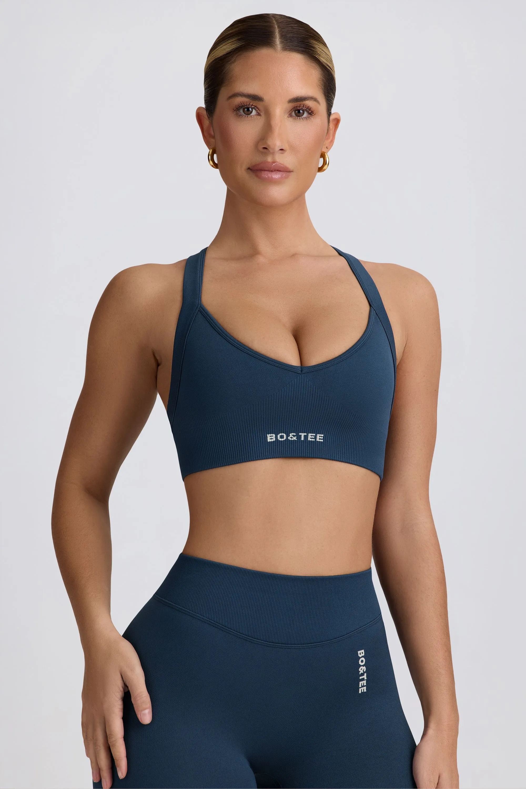 Super Sculpt Seamless Cross-Back Sports Bra in Blue sold by Bo + Tee product image thumbnail 5