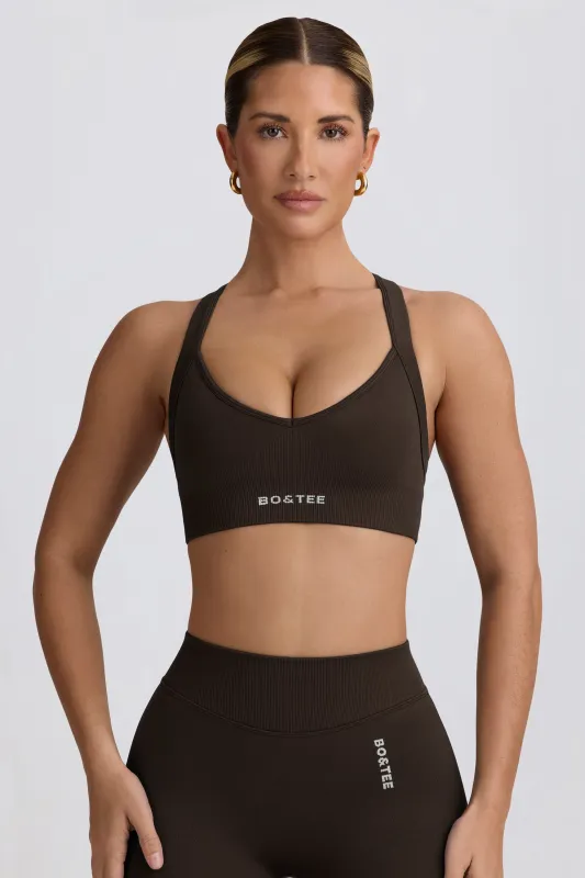 Super Sculpt Seamless Cross-Back Sports Bra in Brown sold by Bo + Tee