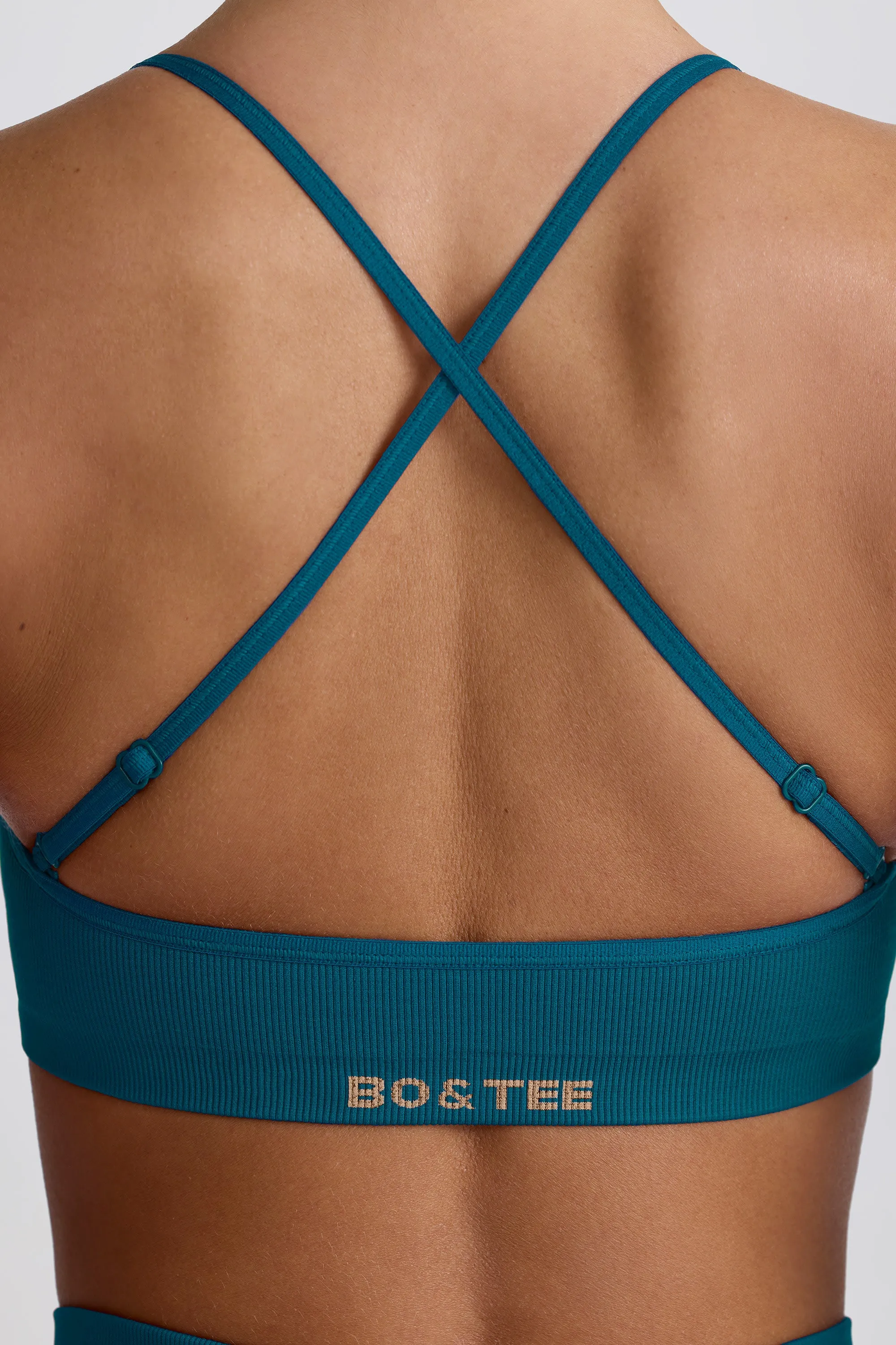 Super Sculpt Seamless Cross-Back Sports Bra in Teal sold by Bo + Tee product image thumbnail 5