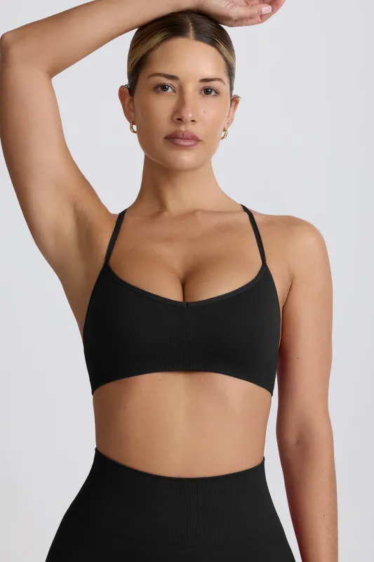 Super Sculpt Seamless Cross-Back Sports Bra in Black sold by Bo + Tee