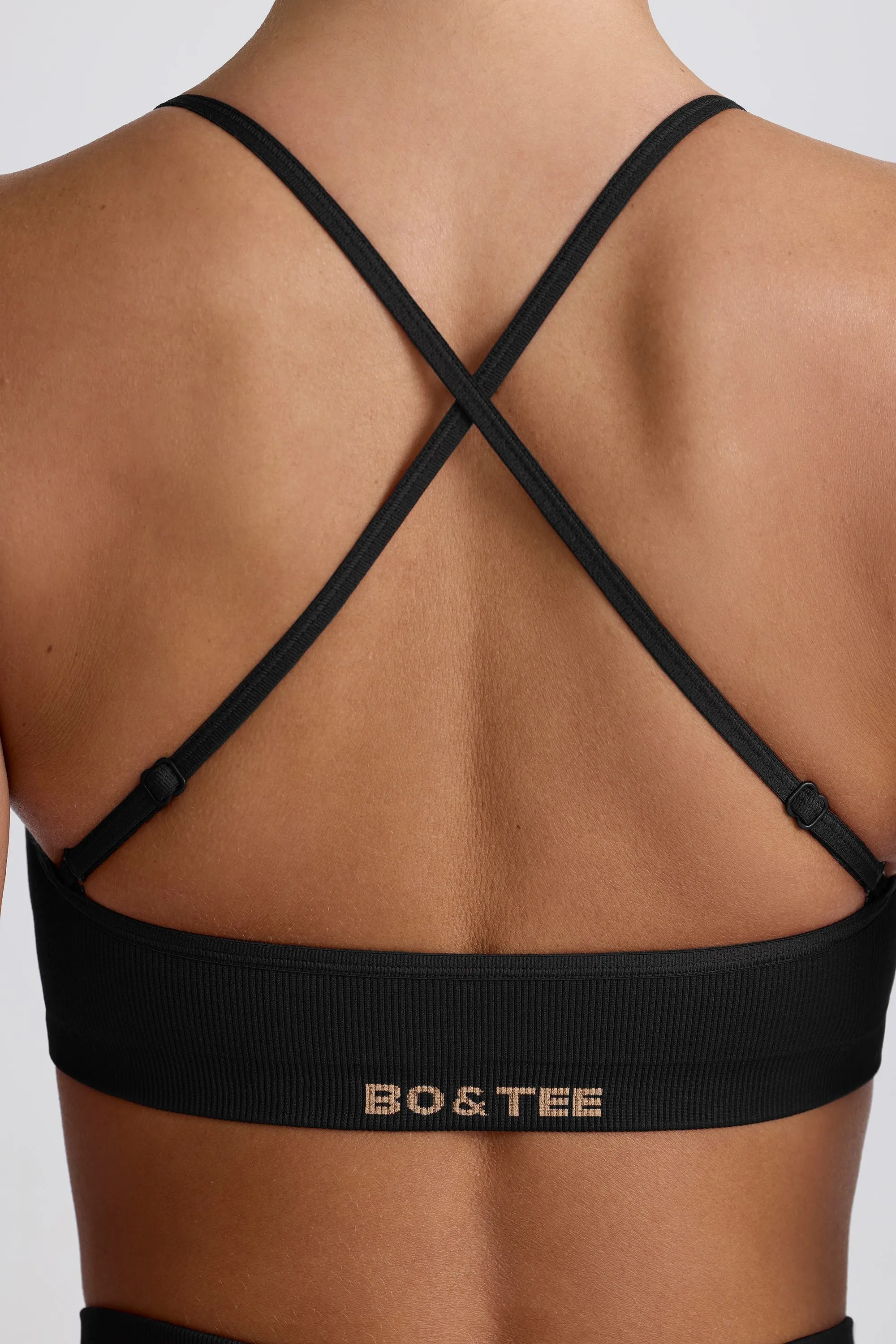 Super Sculpt Seamless Cross-Back Sports Bra in Black sold by Bo + Tee product image thumbnail 5