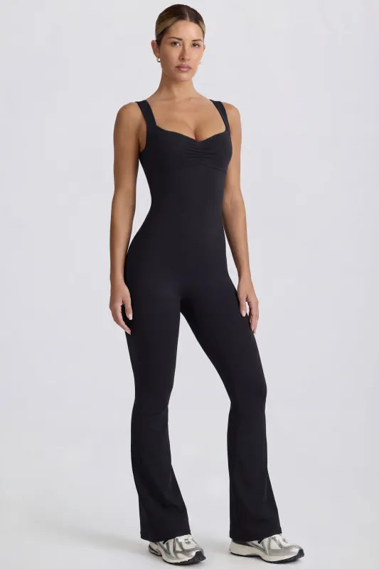 Soft Active Cut Out Back Jumpsuit in Black sold by Bo + Tee