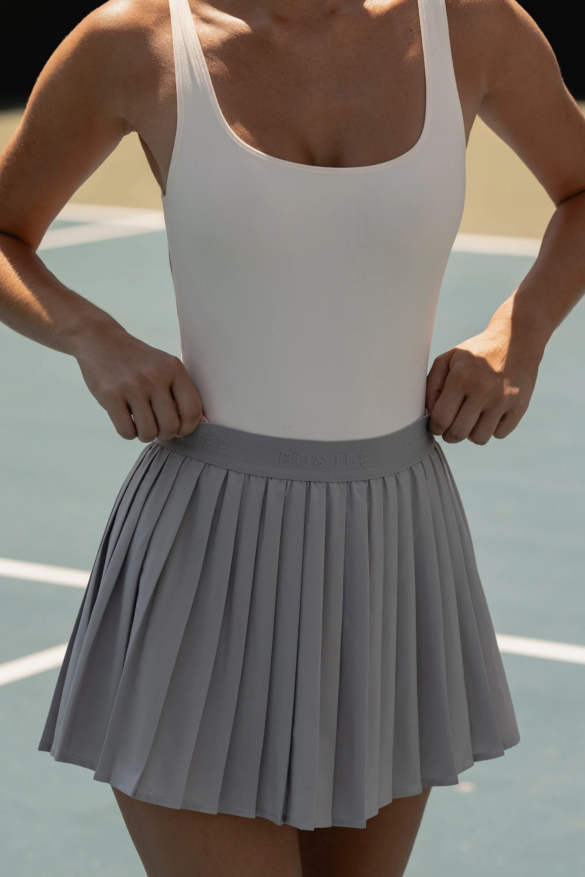 Pleated Tennis Skirt in Ice Grey sold by Bo + Tee