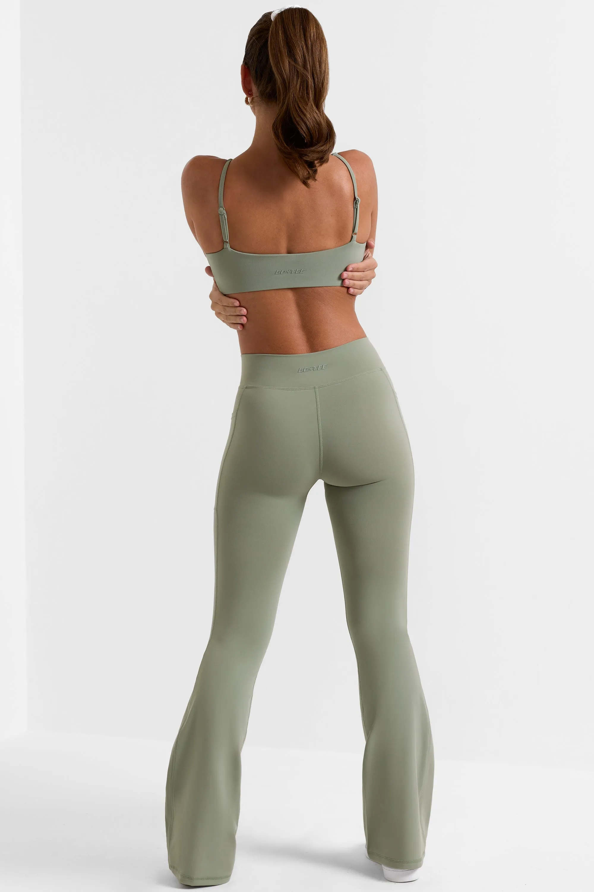 Match - Cross Waistband Flare Pocket Leggings in Bamboo Green sold by Bo + Tee product image thumbnail 3