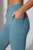 Realign - Petite Twist Waist Flare Leggings in Slate Blue sold by Bo + Tee