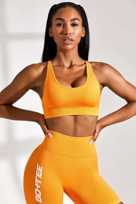 Strength - Plunge Neckline Sports Bra in Orange sold by Bo + Tee