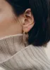 Éole Slim Hoop Earrings - Taupe Leather sold by Polene