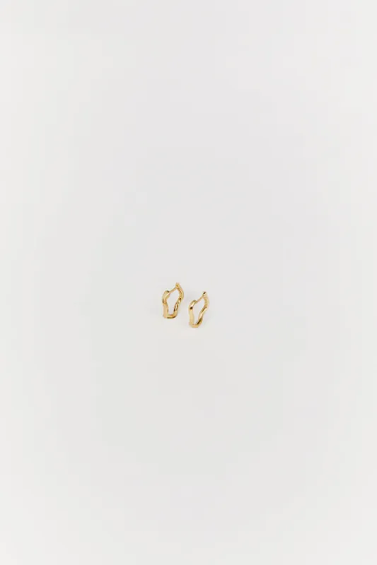 SAINT VALENTINE VERA WAVE GOLD HUGGIE EARRINGS sold by Dissh