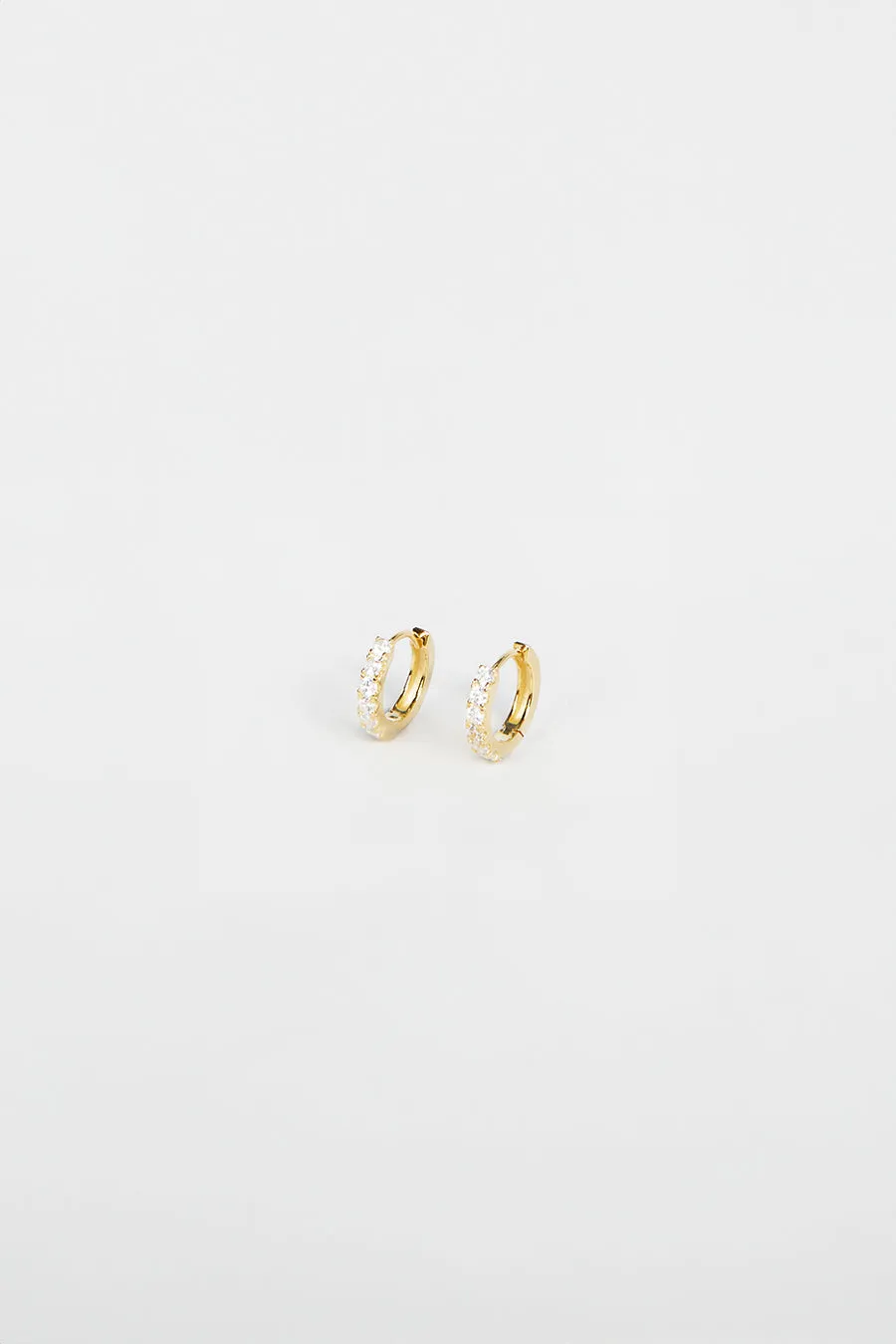 PORTER ANGEL CLEAR/GOLD HUGGIE EARRINGS sold by Dissh