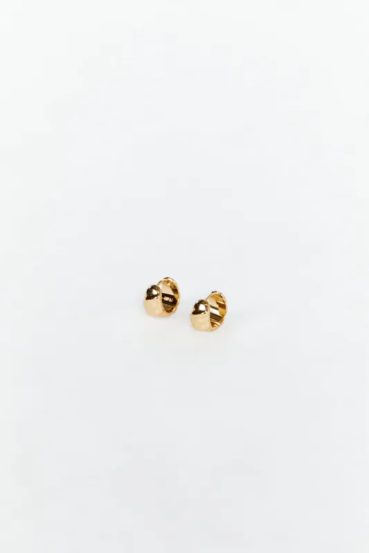 LUV AJ HAMMERED GOLD HUGGIE EARRINGS sold by Dissh