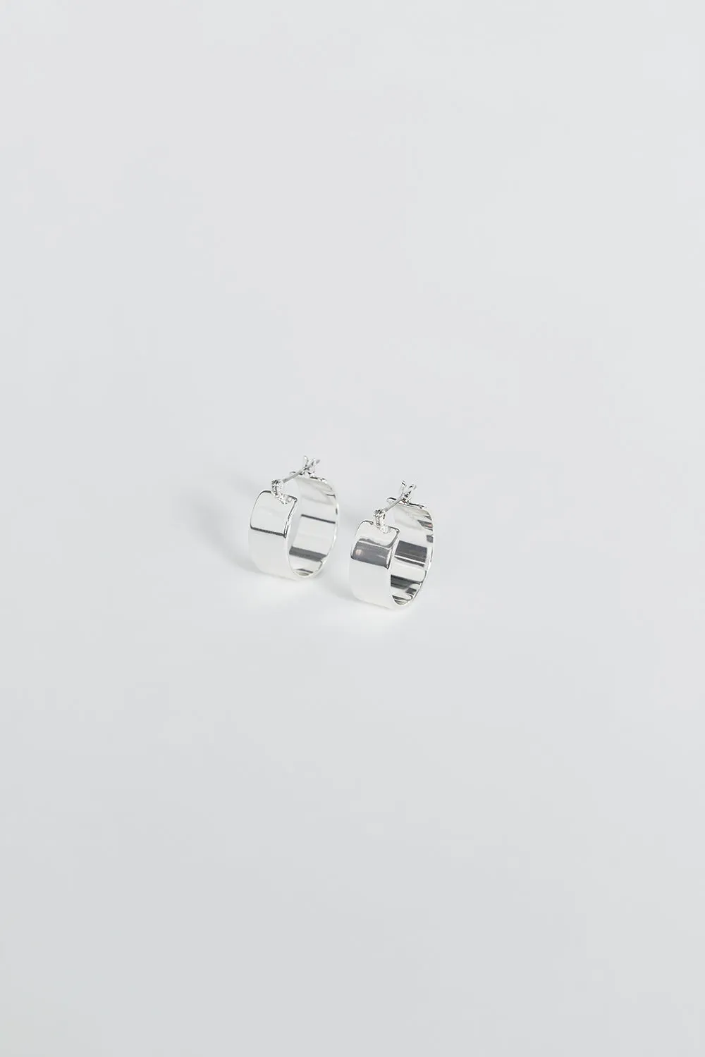 LUV AJ THE POSITANO SILVER HOOPS sold by Dissh