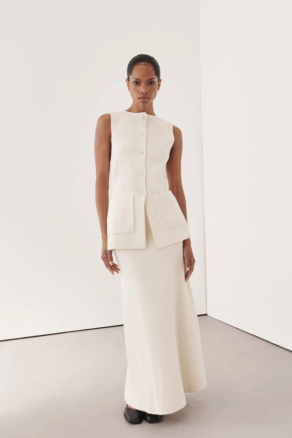 AVA CREAM LONGLINE KNIT MIDI SKIRT sold by Dissh