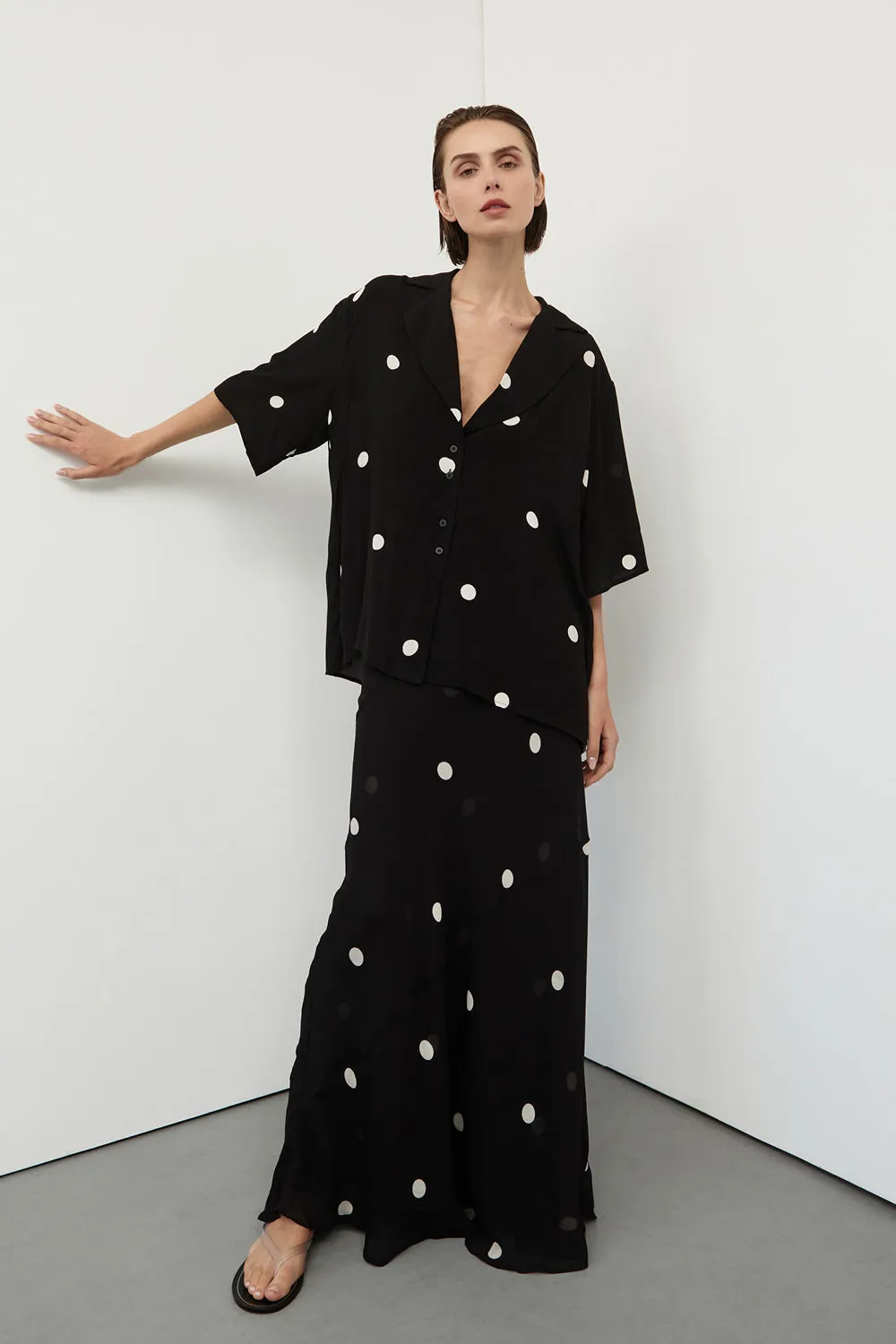 LAURA BLACK SPOT MIDI SKIRT sold by Dissh