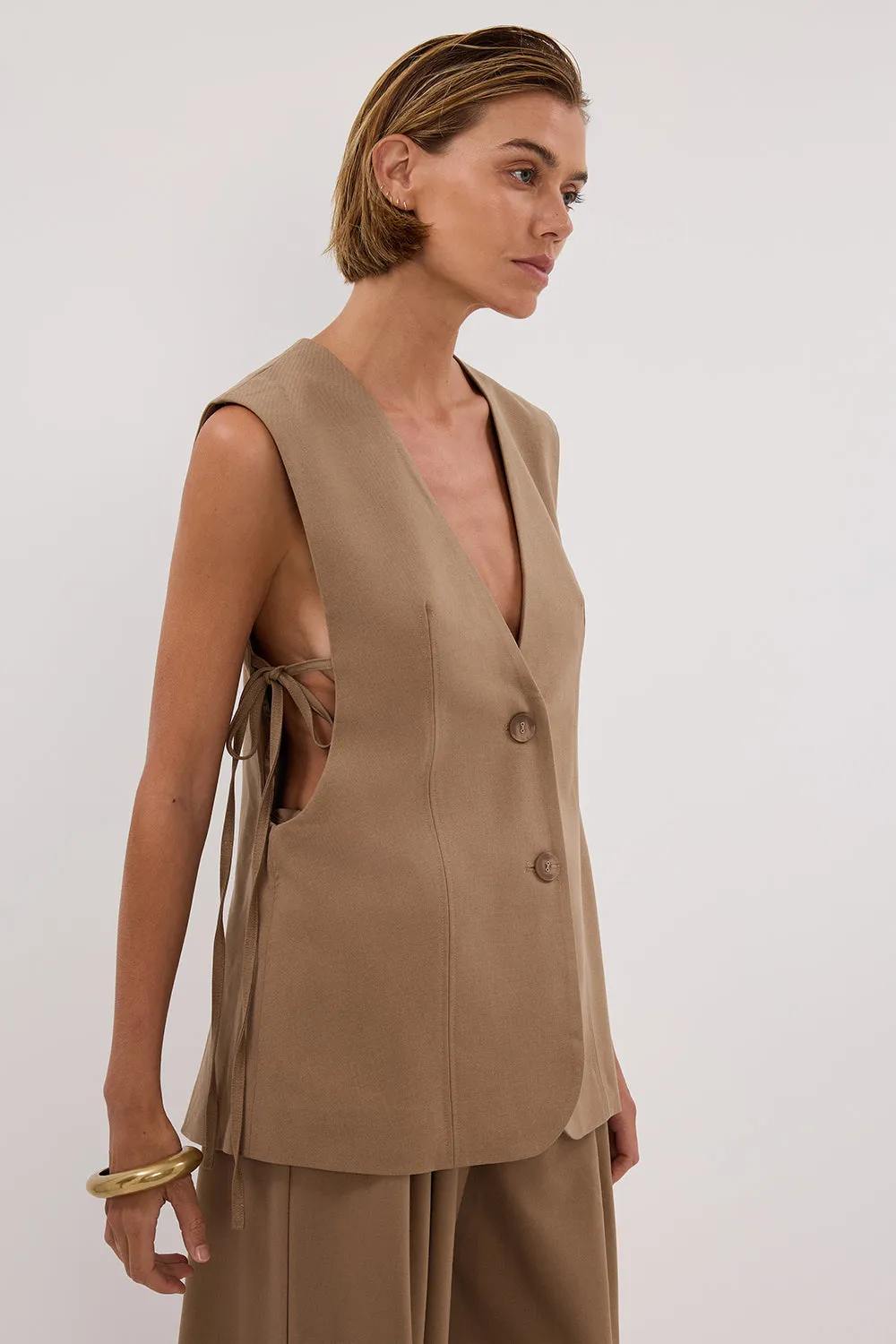 LISE TAN LOW CUT VEST sold by Dissh