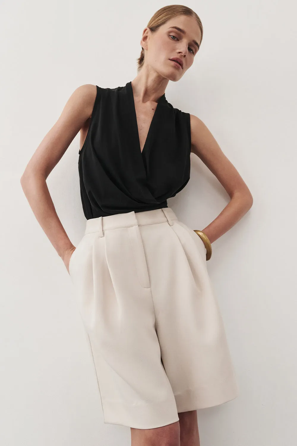 FELICITY BLACK SLEEVELESS WRAP TOP sold by Dissh
