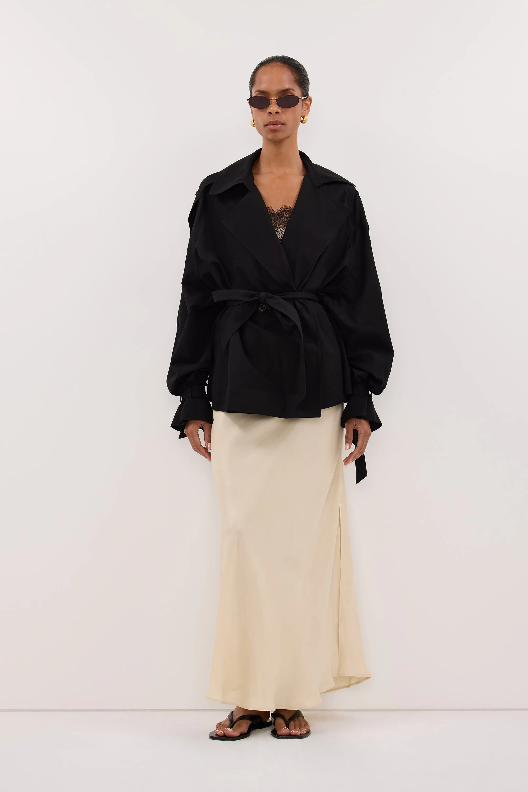NINA BLACK LIGHTWEIGHT MINI TRENCH sold by Dissh