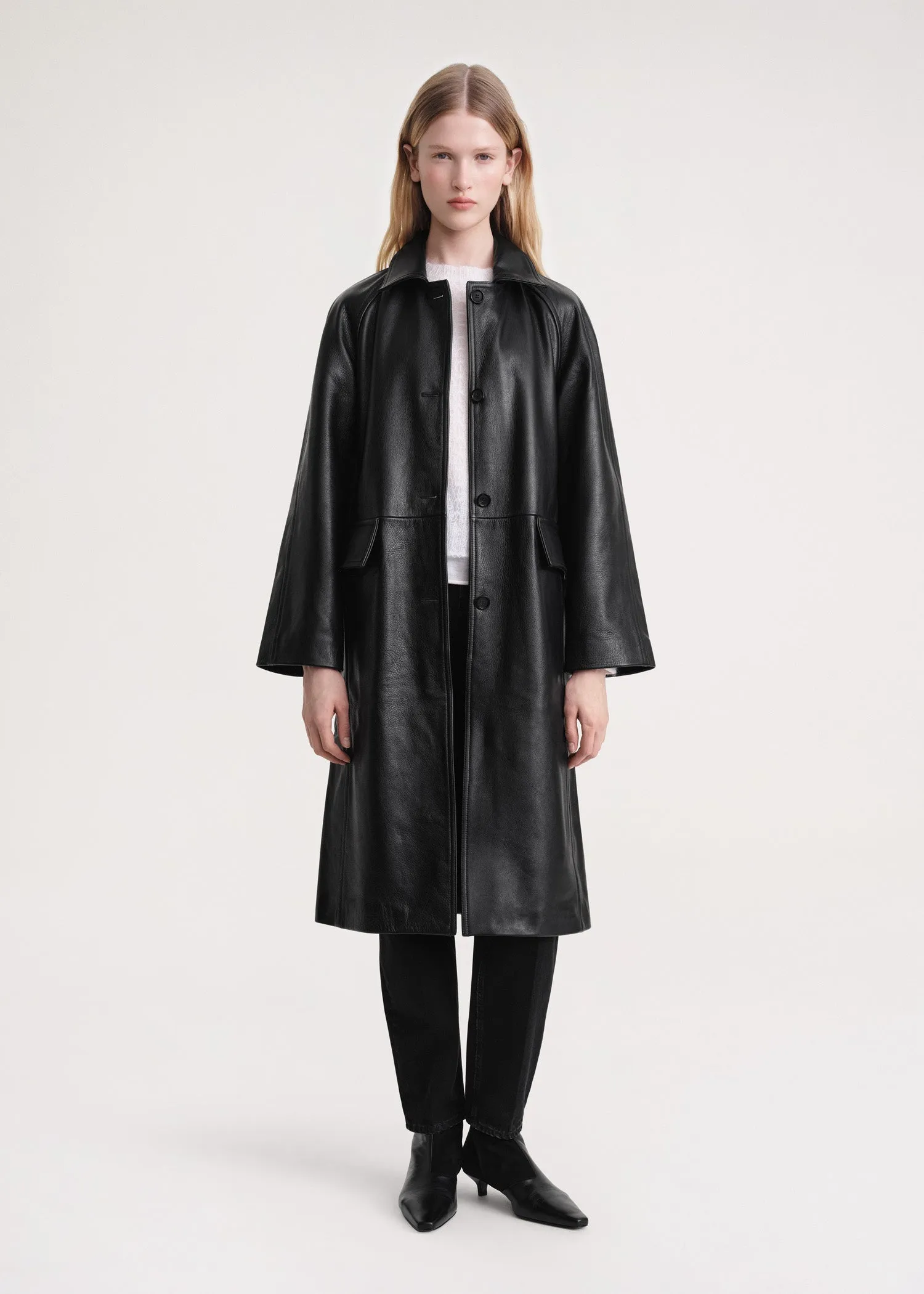 Raglan-sleeve leather coat black sold by Toteme