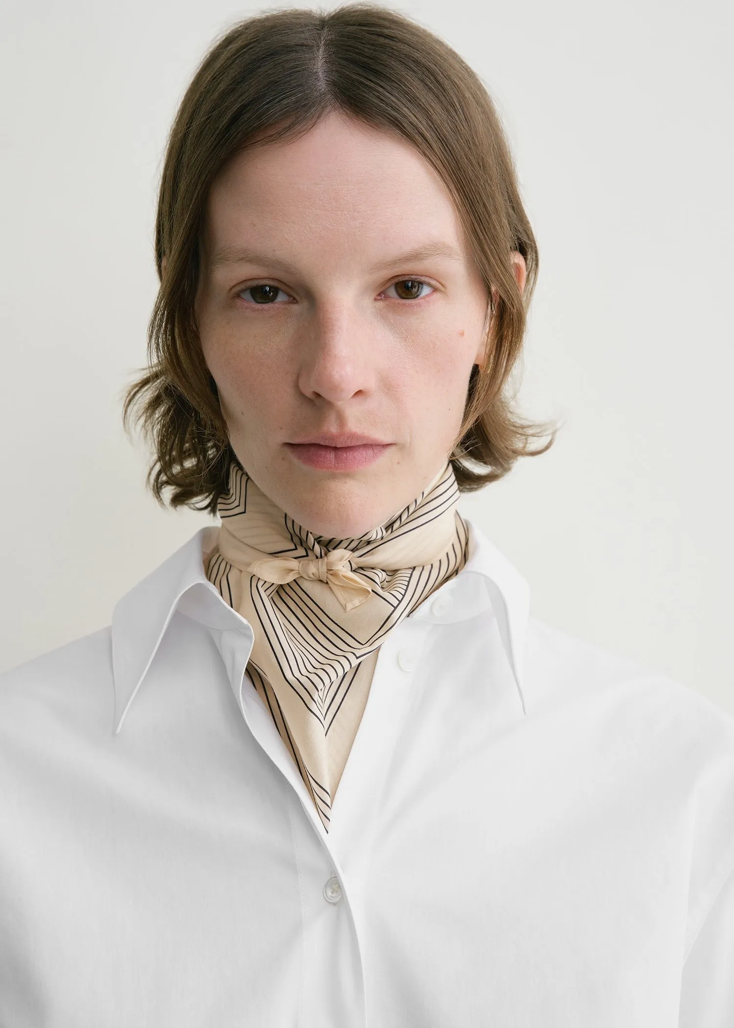 Striped monogram cotton silk scarf crème sold by Toteme