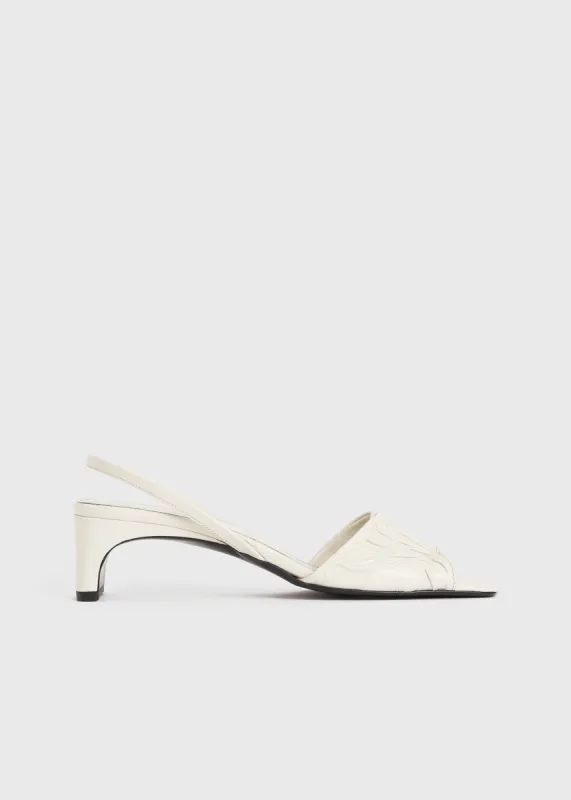 The Gathered Scoop-Heel Sandal snow sold by Toteme