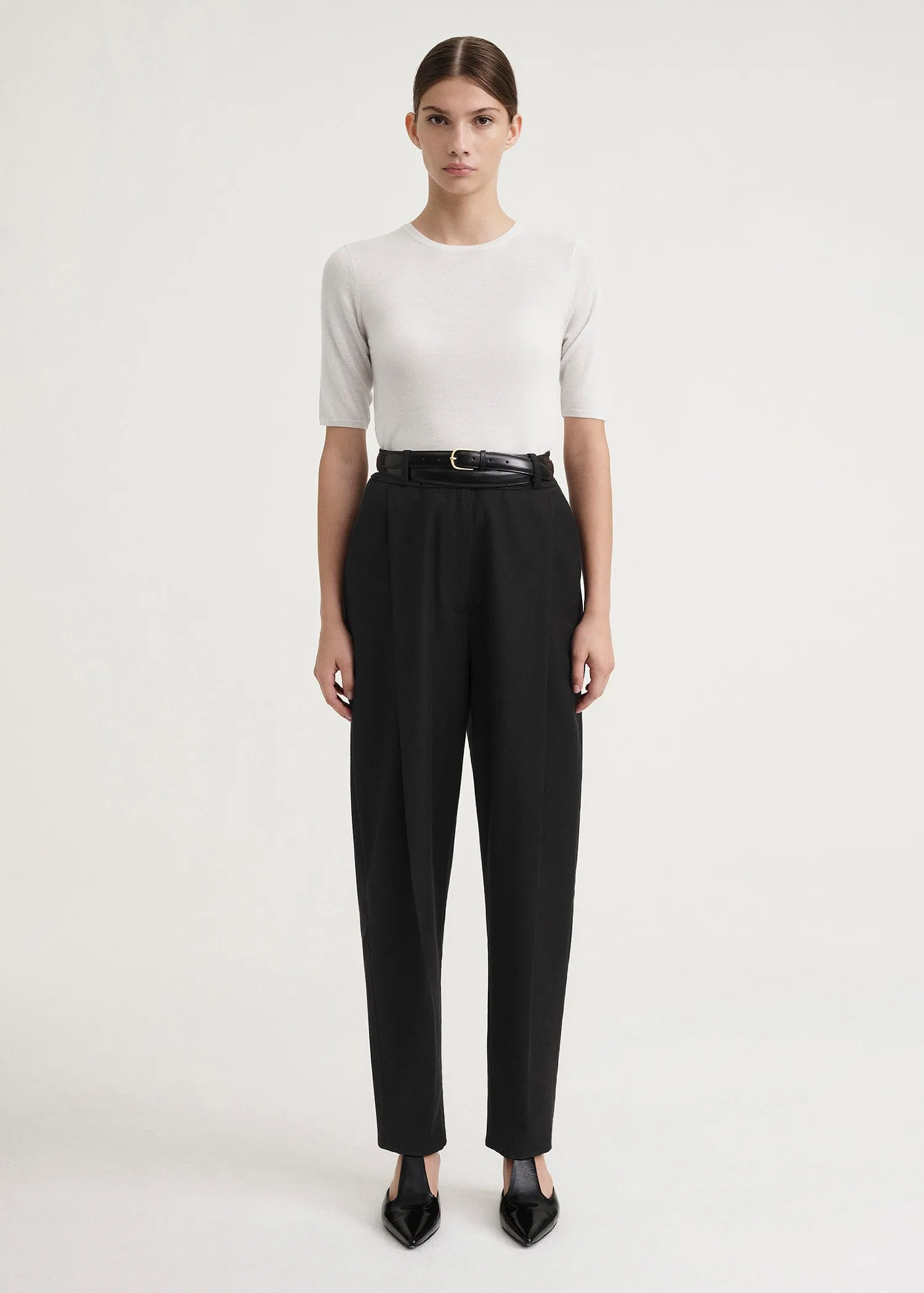 Deep pleat wool trousers black sold by Toteme
