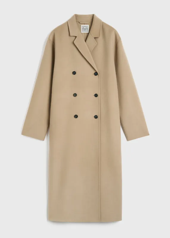 Signature wool doublé coat biscuit sold by Toteme
