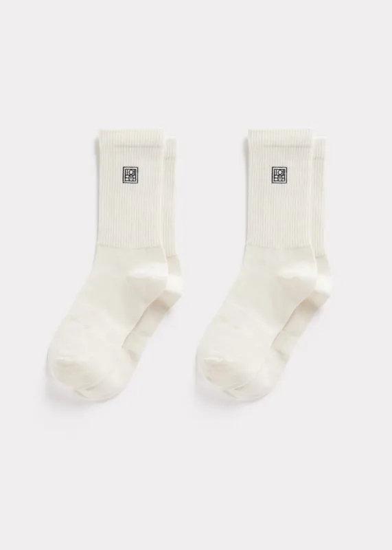 Monogram socks macadamia sold by Toteme