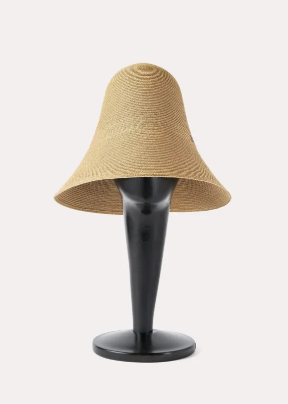 Woven paper straw hat crème sold by Toteme
