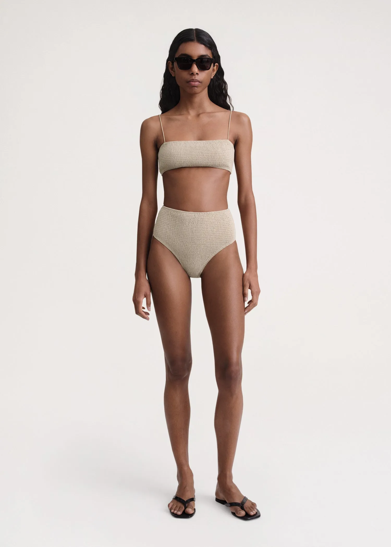 Smocked bikini bottoms overcast beige sold by Toteme