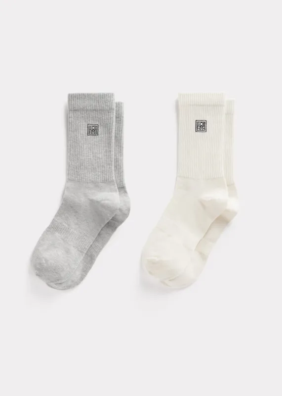Monogram socks grey/macadamia sold by Toteme