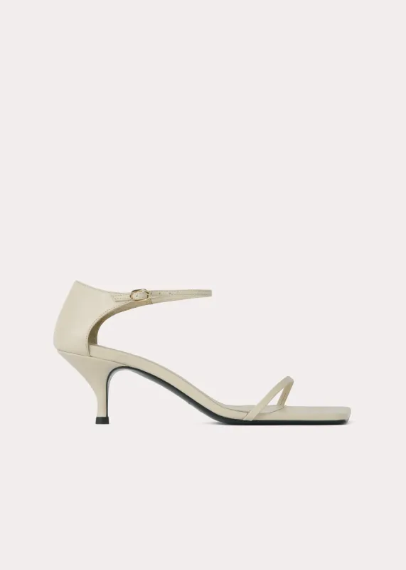 The Strappy Sandal bleached sand sold by Toteme