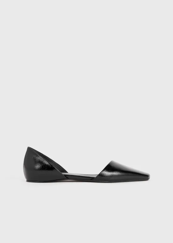The Asymmetric D'Orsay Flat black sold by Toteme