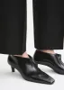 Wide shaft shoes black sold by Toteme