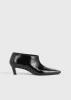 Wide shaft shoes black sold by Toteme