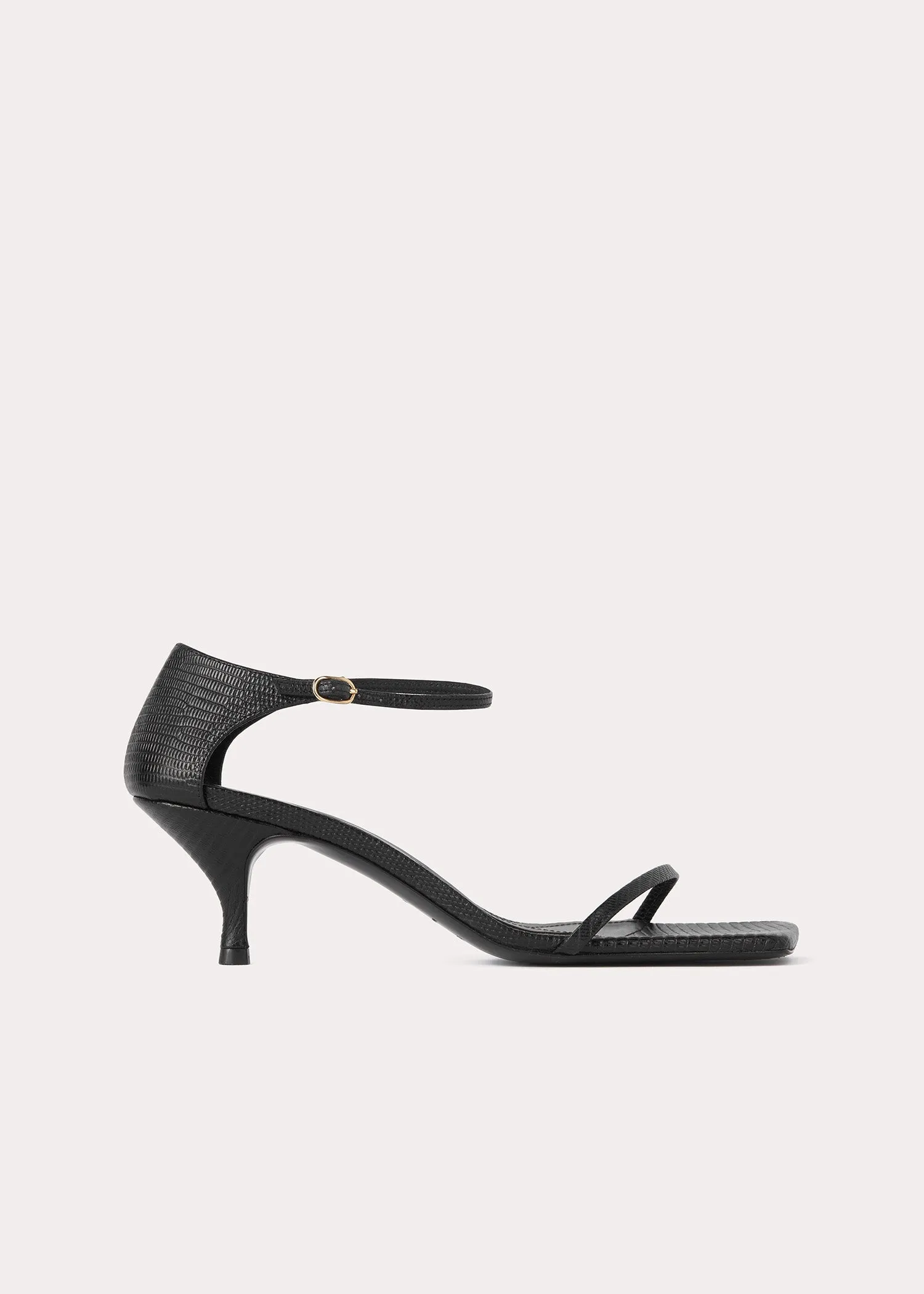 The Strappy Sandal black lizard sold by Toteme
