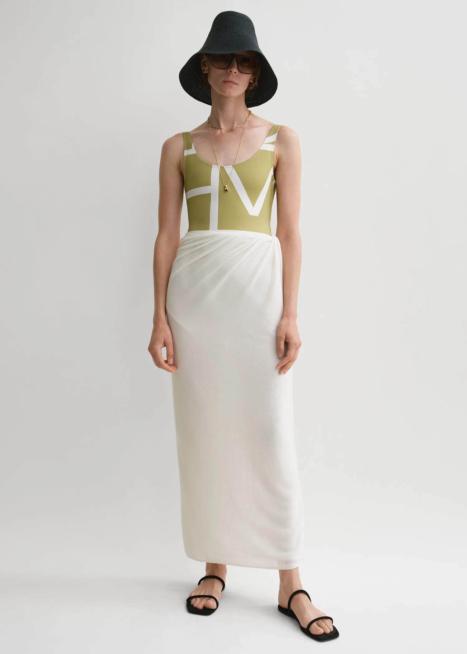 Fine knit sarong light hay sold by Toteme