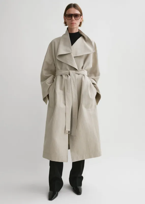 Signature linen-blend coat sand sold by Toteme