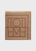 Monogram wool cashmere scarf camel sold by Toteme
