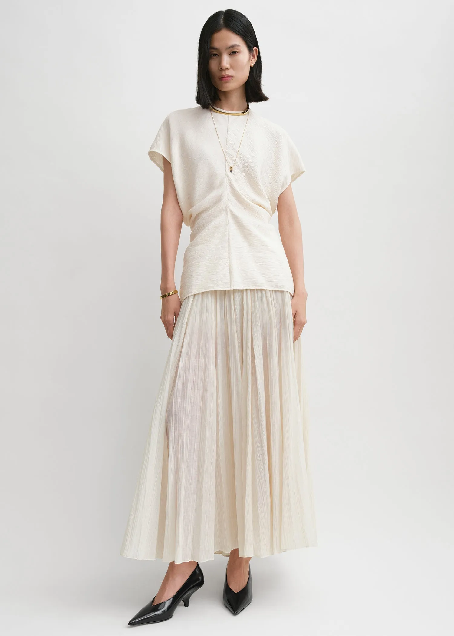 Slouch waist crinkled top cream sold by Toteme