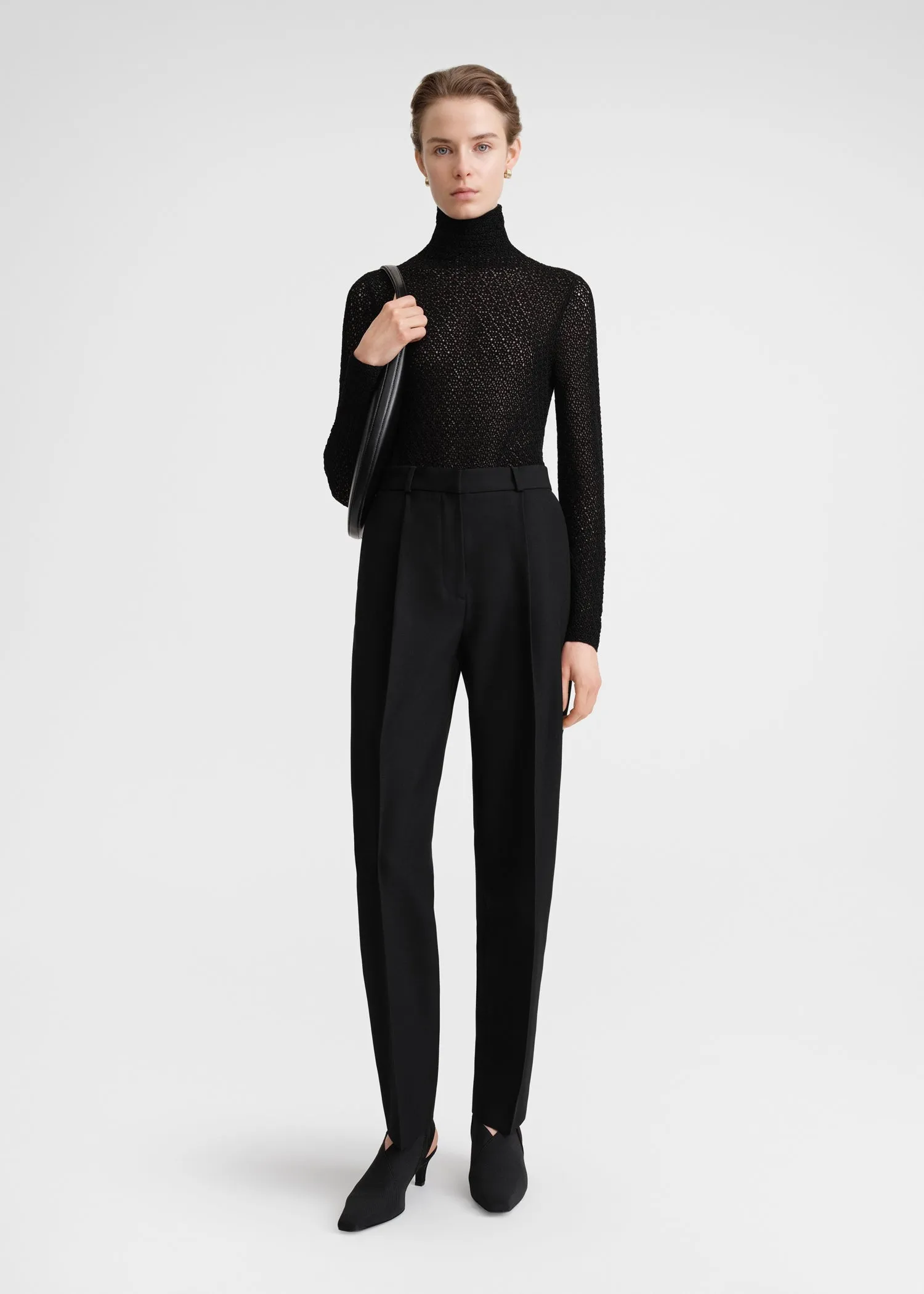Single-pleat tapered trousers black sold by Toteme