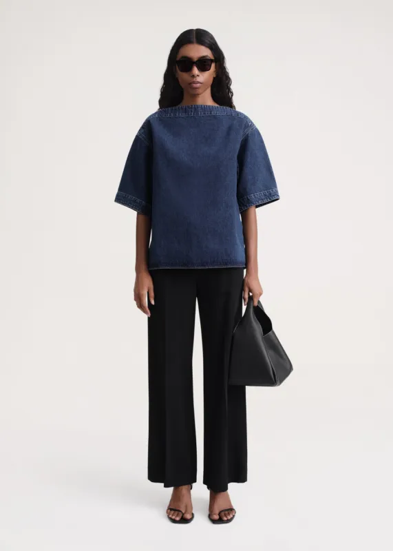 Dart-neck denim top dark blue sold by Toteme