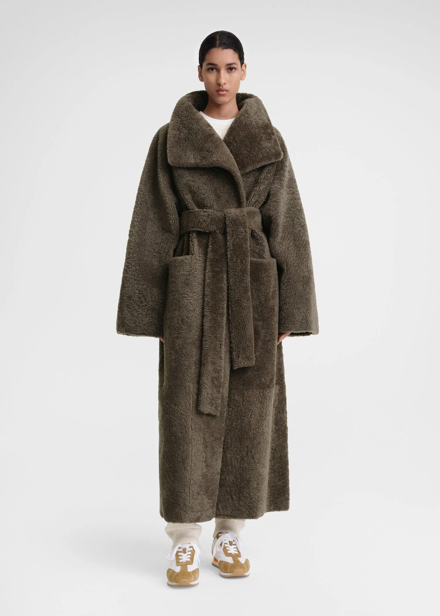 Belted teddy shearling coat cement green sold by Toteme
