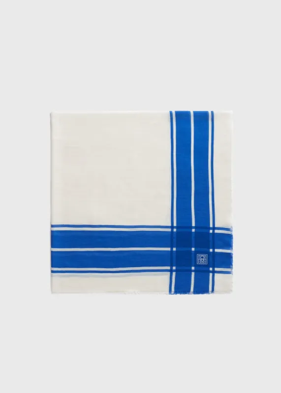 Wool silk blanket scarf blue/ecru sold by Toteme