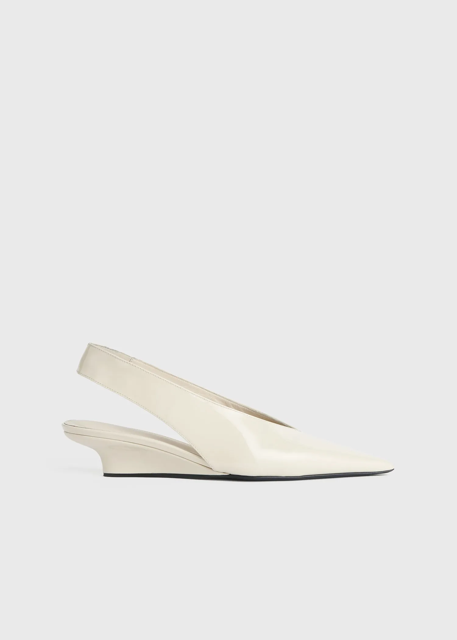 Wedge-heel patent slingbacks sold by Toteme