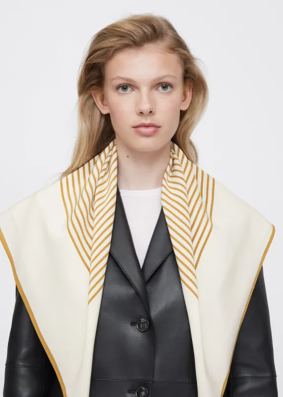 Centered monogram silk scarf bone sold by Toteme