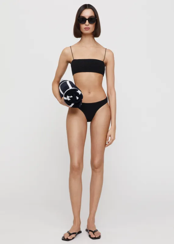 Smocked mini bikini bottoms black sold by Toteme