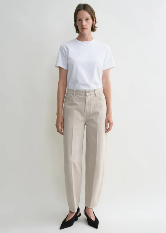 Wide tapered leg denim smoke grey sold by Toteme