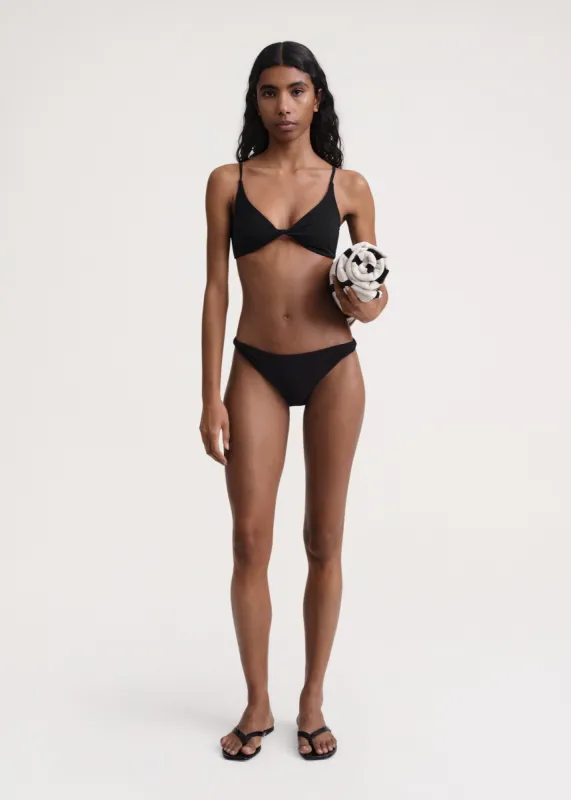 Twist-front bikini top black made by Toteme