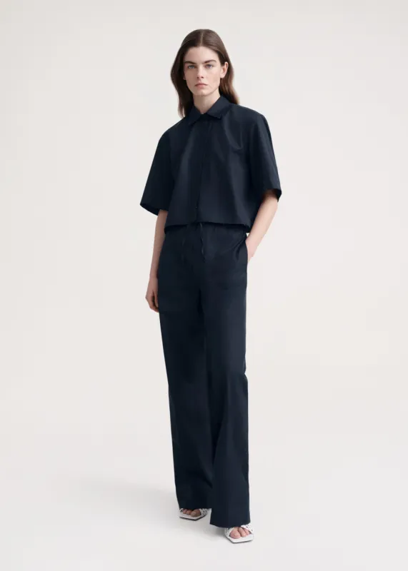 Cotton drawstring trousers dark navy sold by Toteme