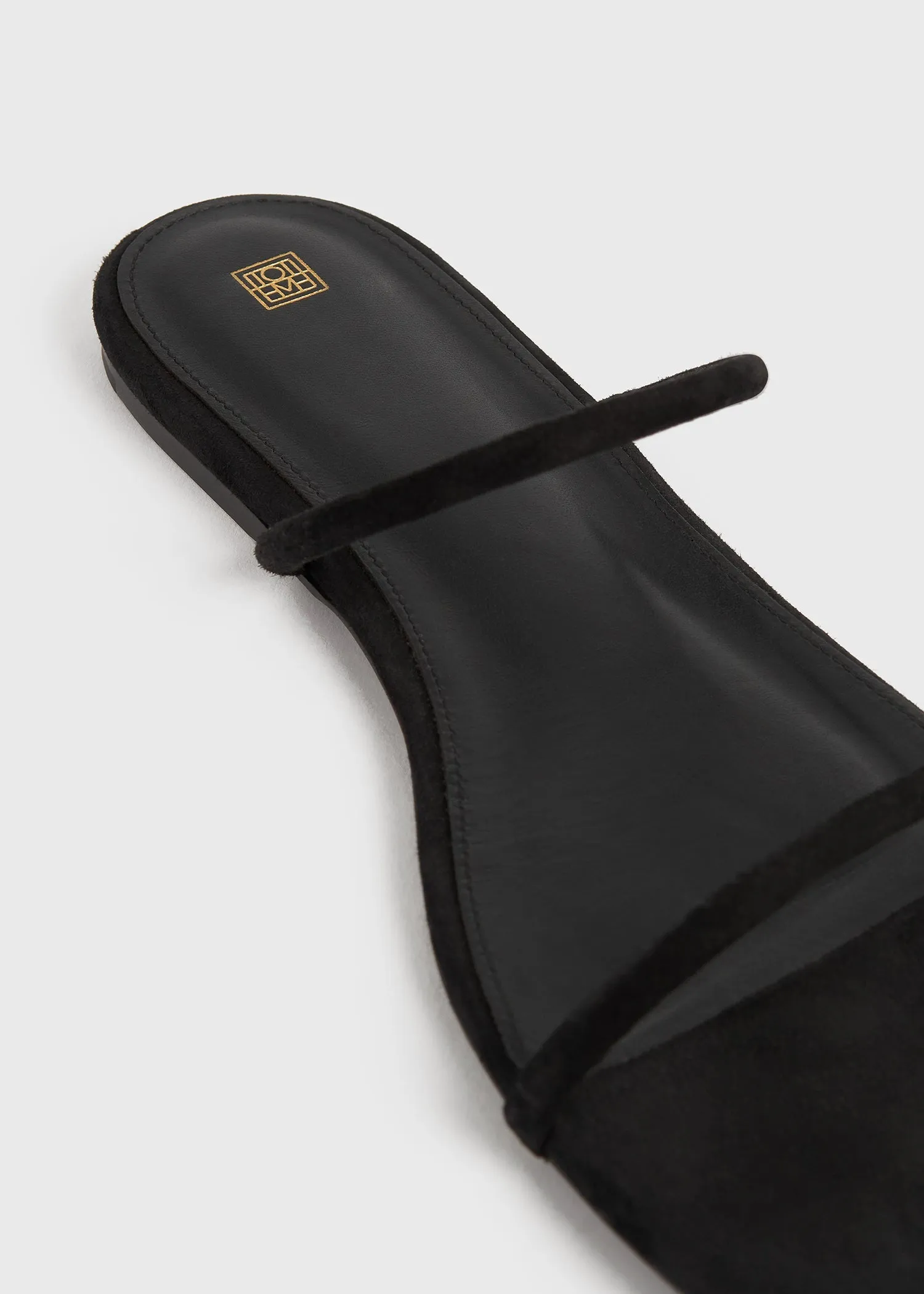 Minimalist suede slides black sold by Toteme product image thumbnail 3