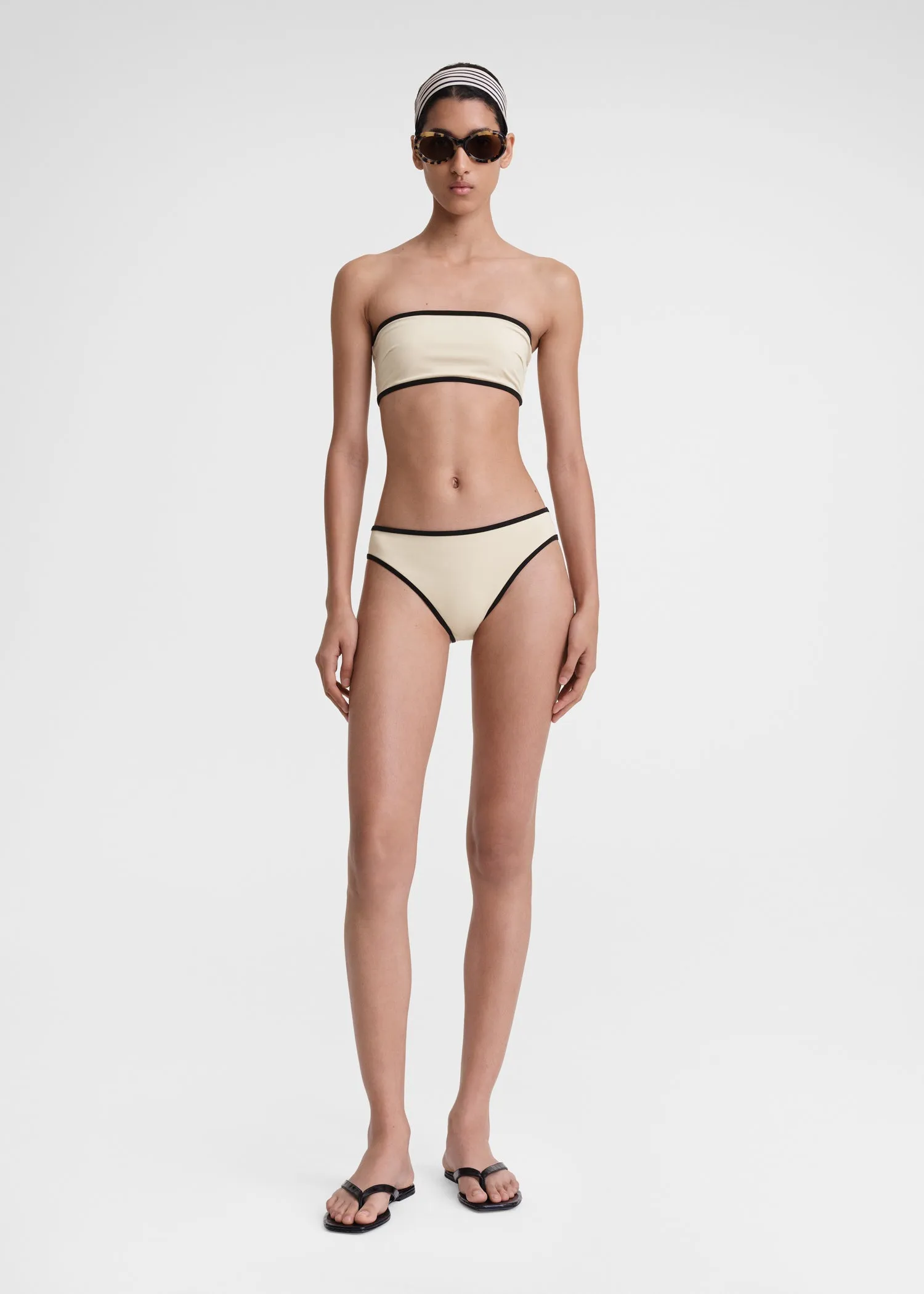 Stripe edge bikini bottoms light hay sold by Toteme